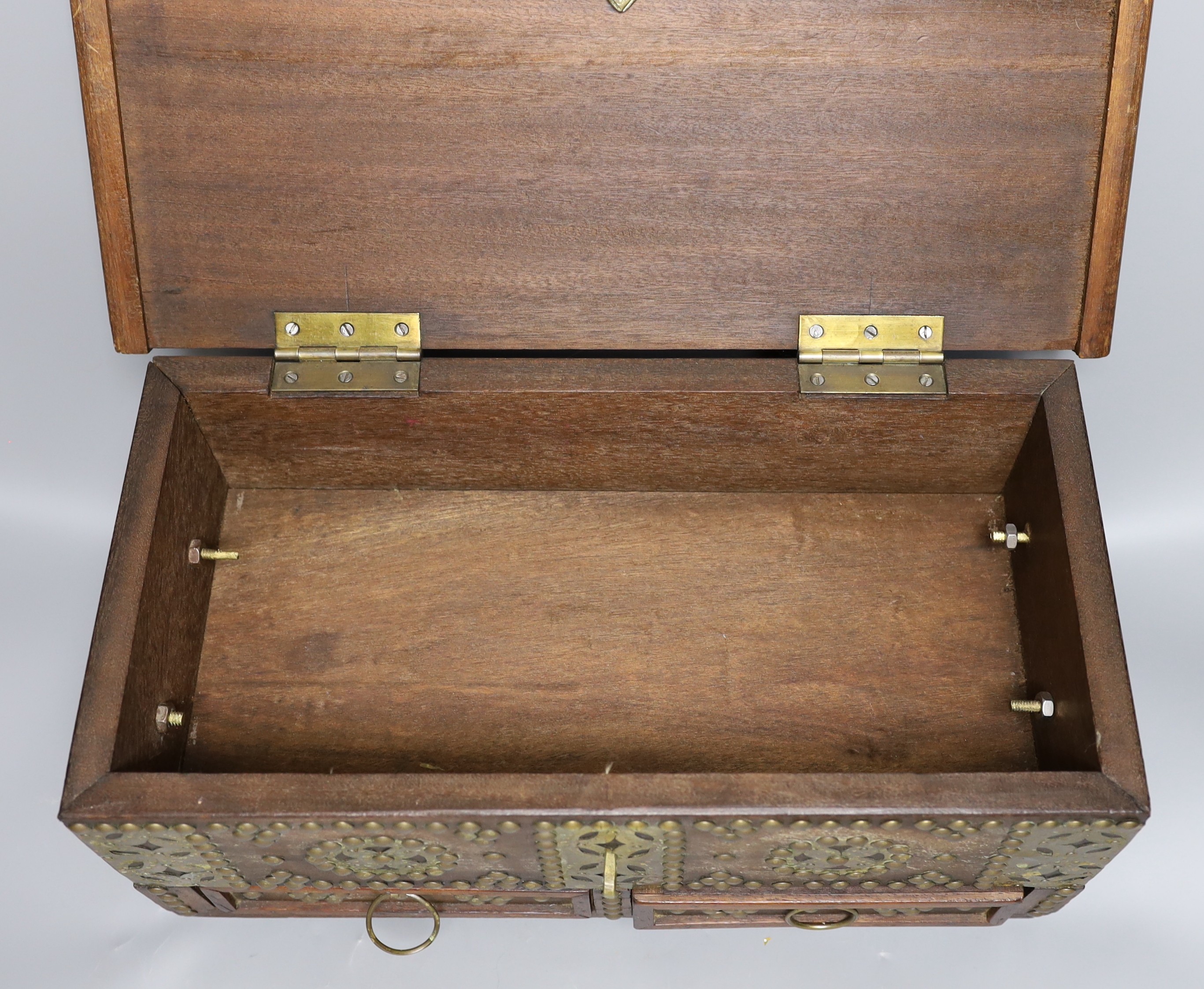 An Indian brass studded and mounted box, 45cms wide x 21cms high